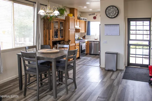 a view of a dining room with furniture window and wooden floor