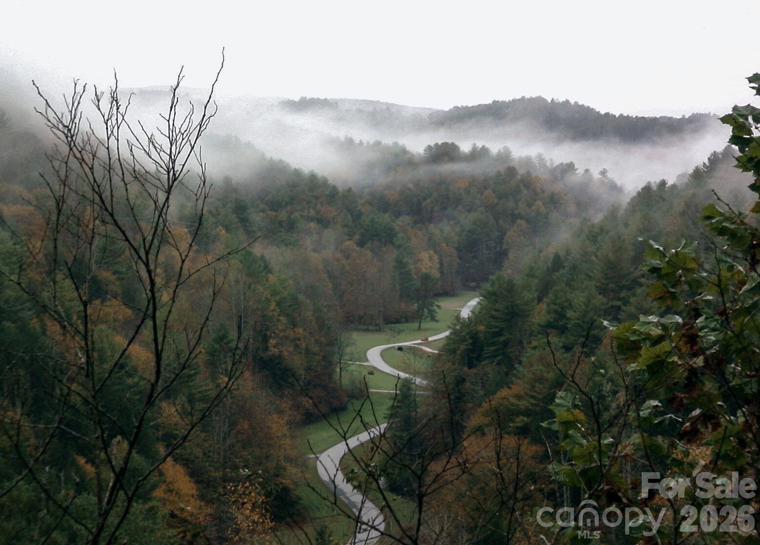 0 Big Sky Road Ferguson, NC 28624 - Photo 4 of 10 a view of a lake with a mountain in the background