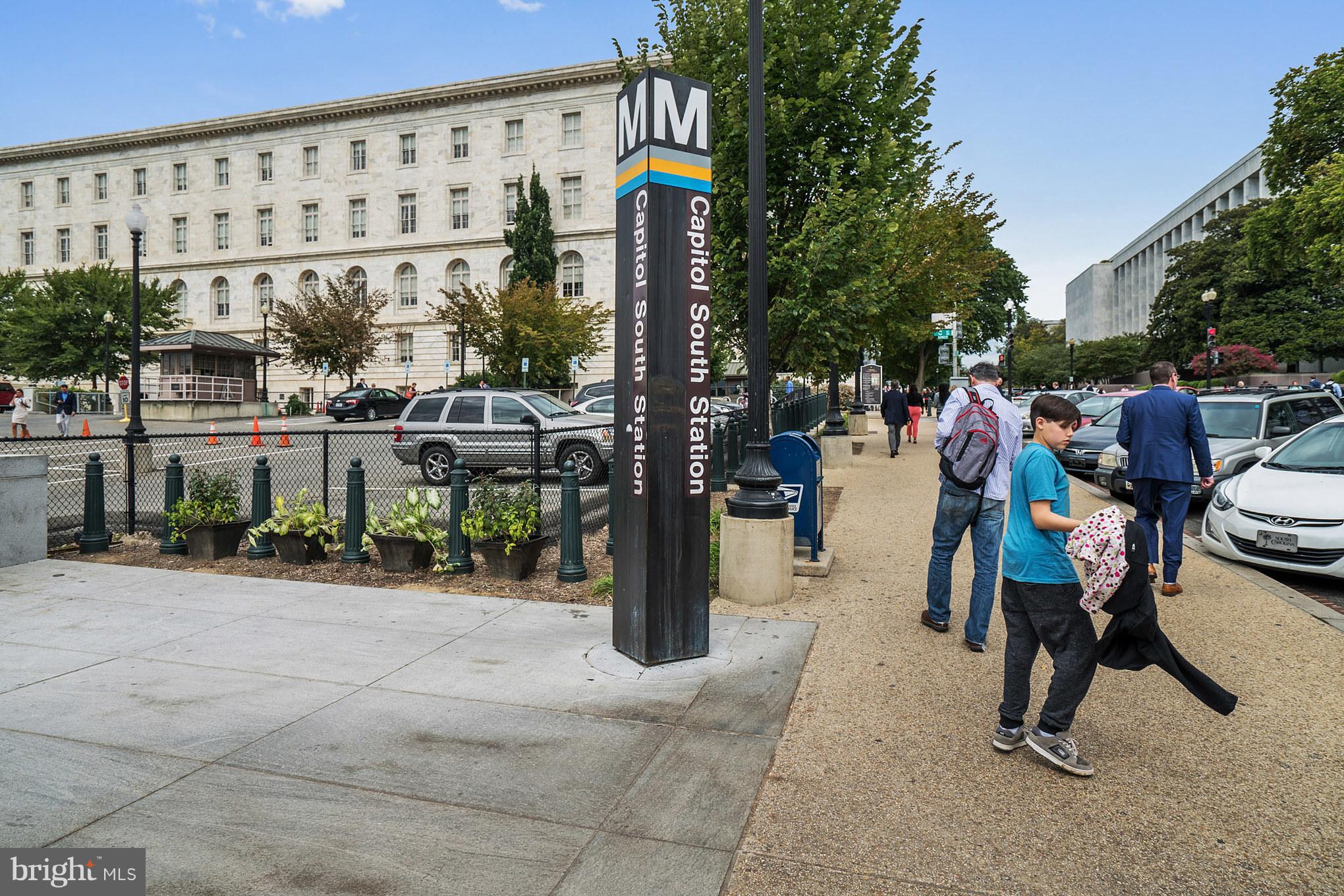 115 D Street Southeast, Unit 103 Washington, DC 20003 - Photo 11 of 14 a group of people sitting in front of a building