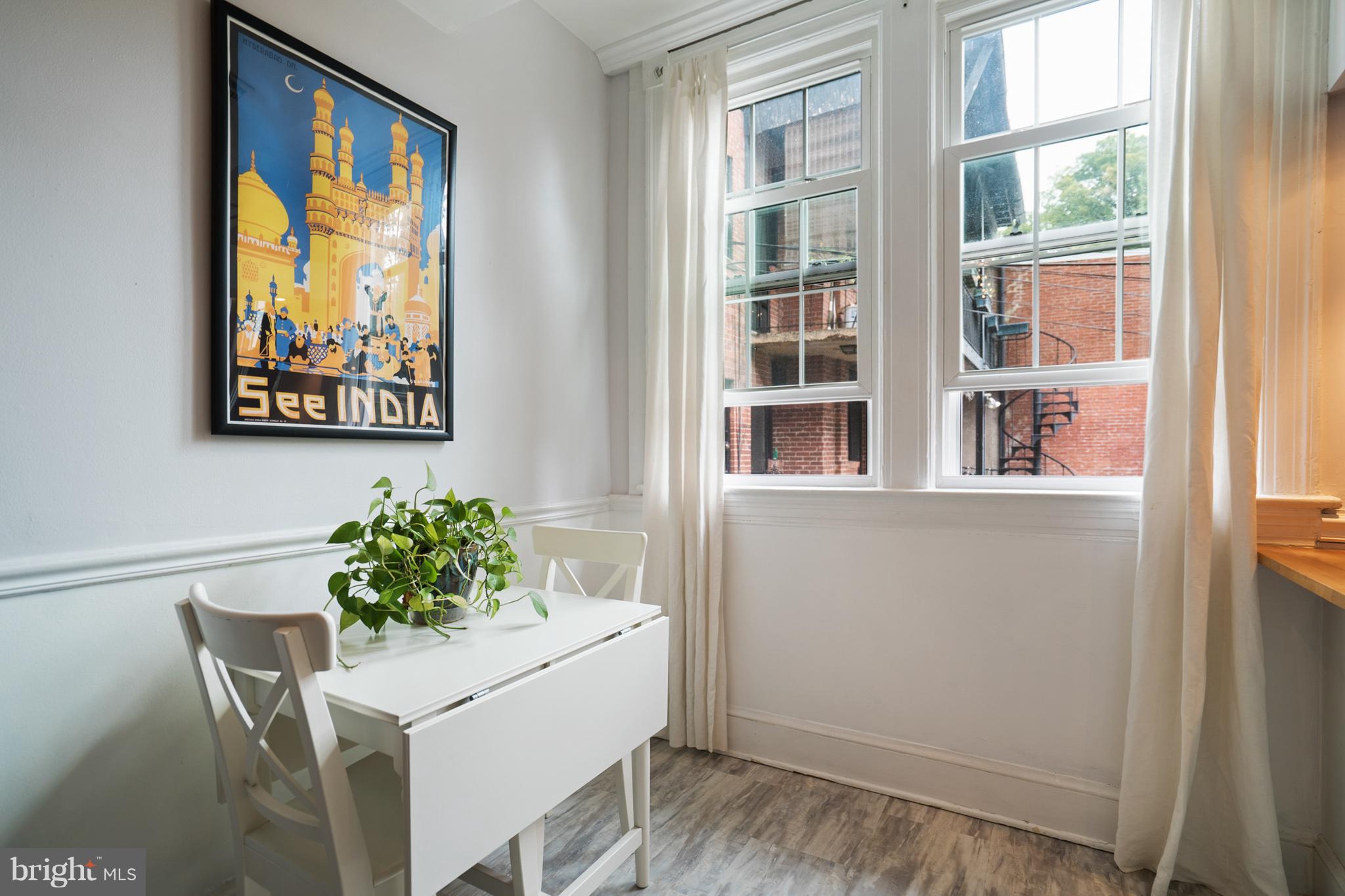 115 D Street Southeast, Unit 103 Washington, DC 20003 - Photo 4 of 14 a dining room with furniture and window