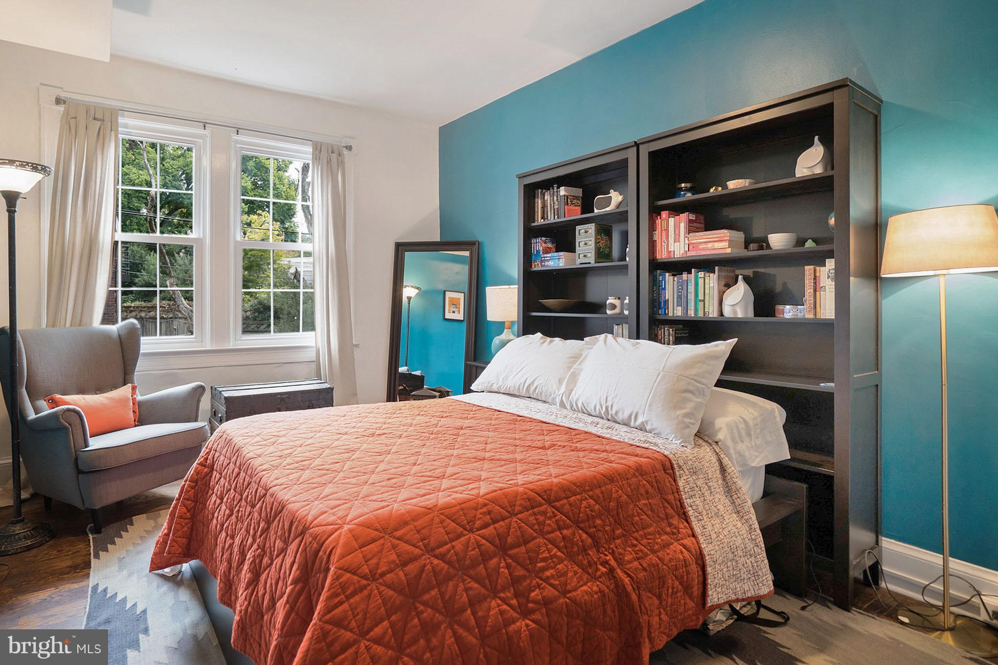 115 D Street Southeast, Unit 103 Washington, DC 20003 - Photo 5 of 14 a bedroom with a bed and a large window