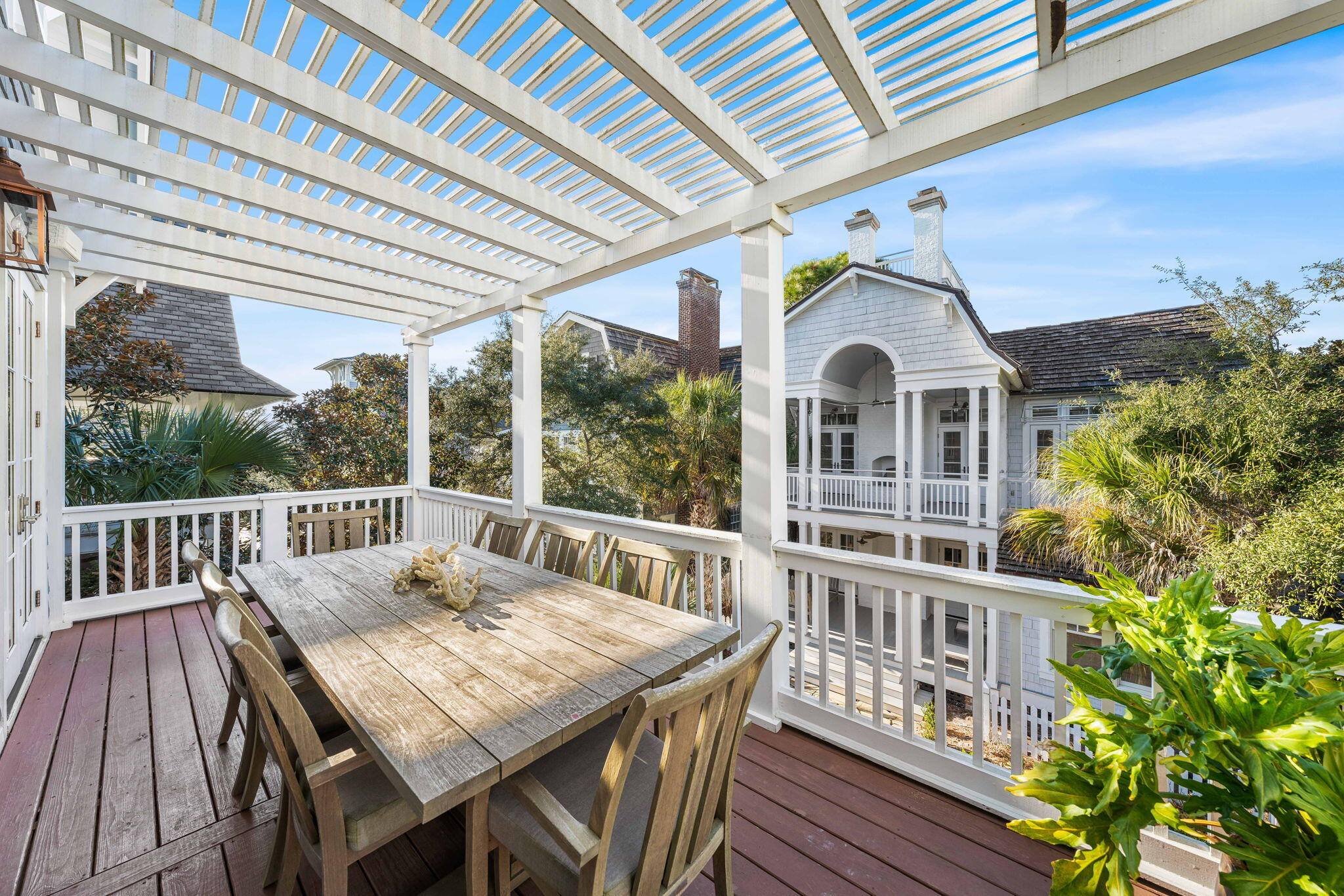 90 South Founders Lane Inlet Beach, FL 32461 - Photo 5 of 44 a view of a deck with table and chairs with wooden floor and fence
