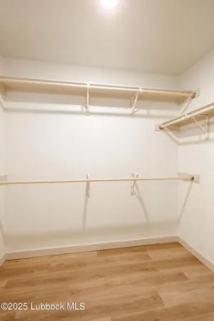 a view of a room with an empty walk in closet