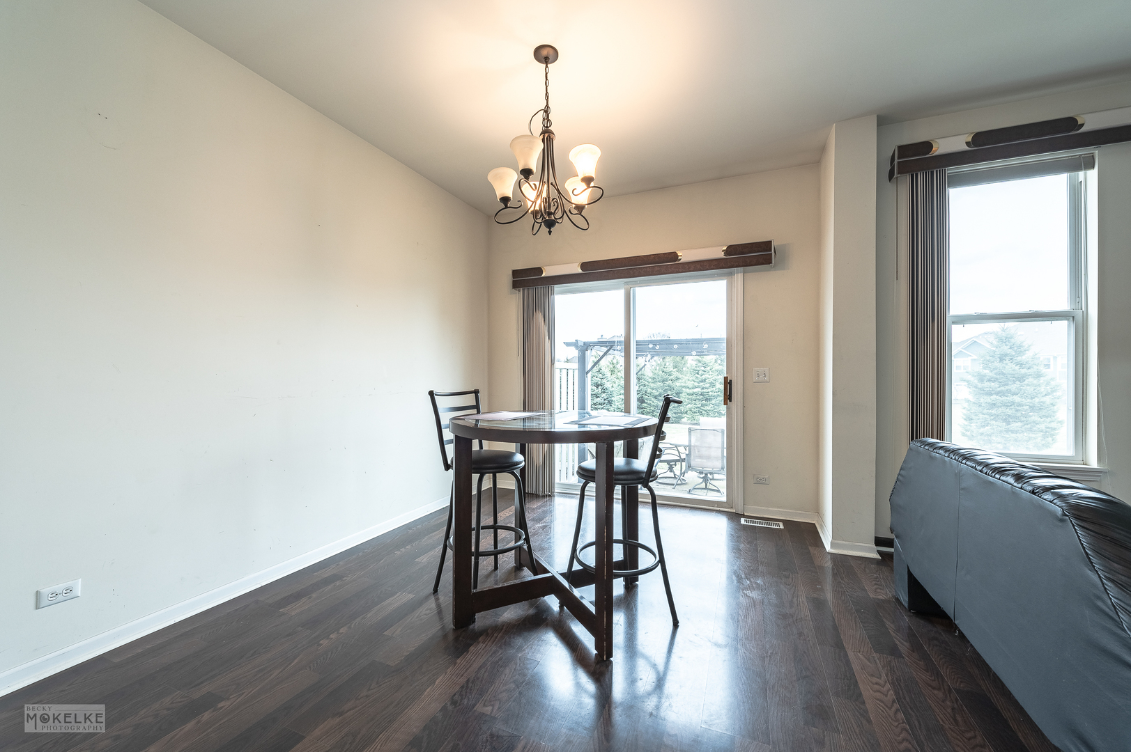 286 Wolverine Drive Oswego, IL 60543 - Photo 5 of 23 a view of a dining room with furniture window and wooden floor