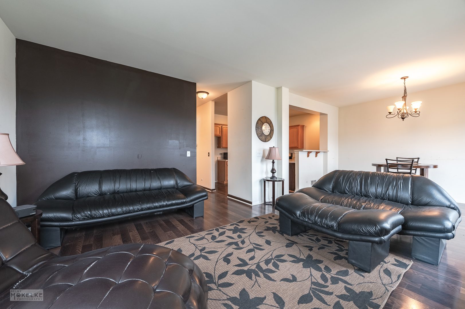 286 Wolverine Drive Oswego, IL 60543 - Photo 7 of 23 a living room with a couch and a stove with wooden floor