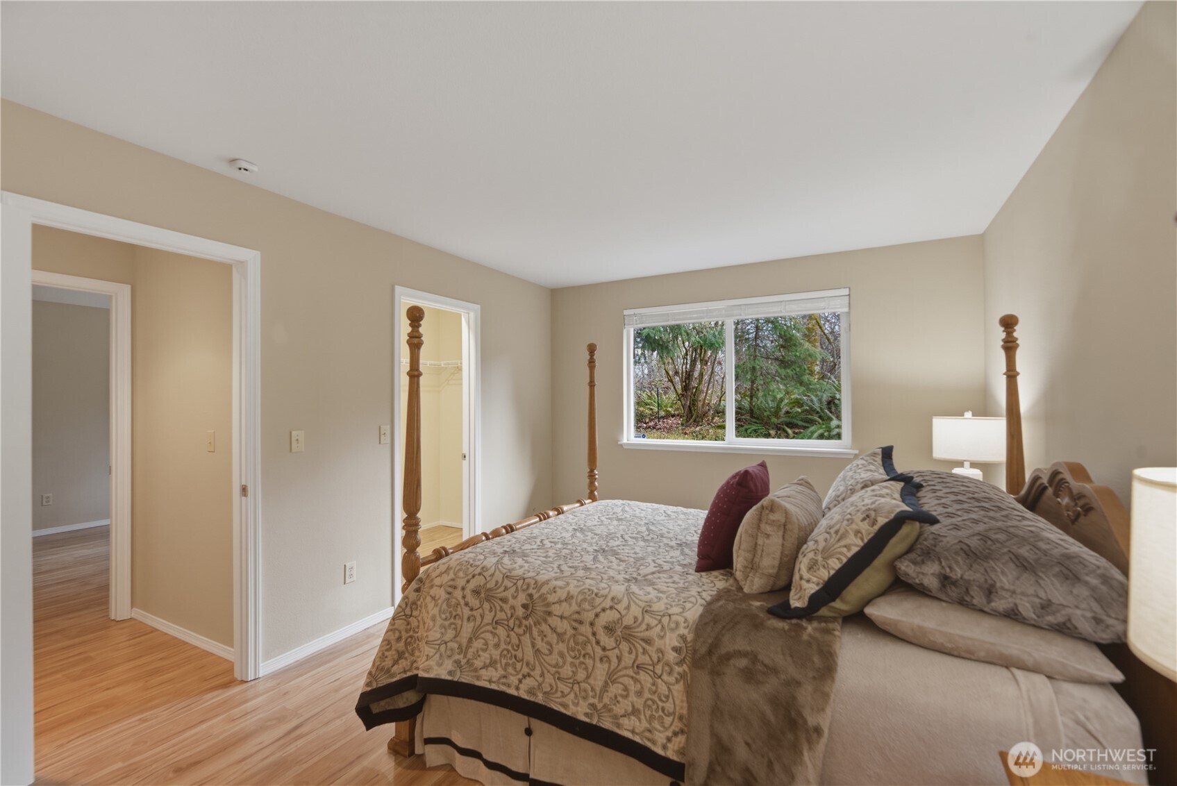 2415 Southeast 8th Place Renton, WA 98057 - Photo 13 of 39 a bed sitting in a bedroom next to a window