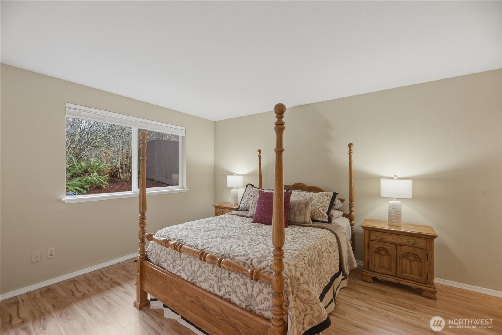 2415 Southeast 8th Place Renton, WA 98057 - Photo 14 of 39 a bedroom with a bed and wooden floor