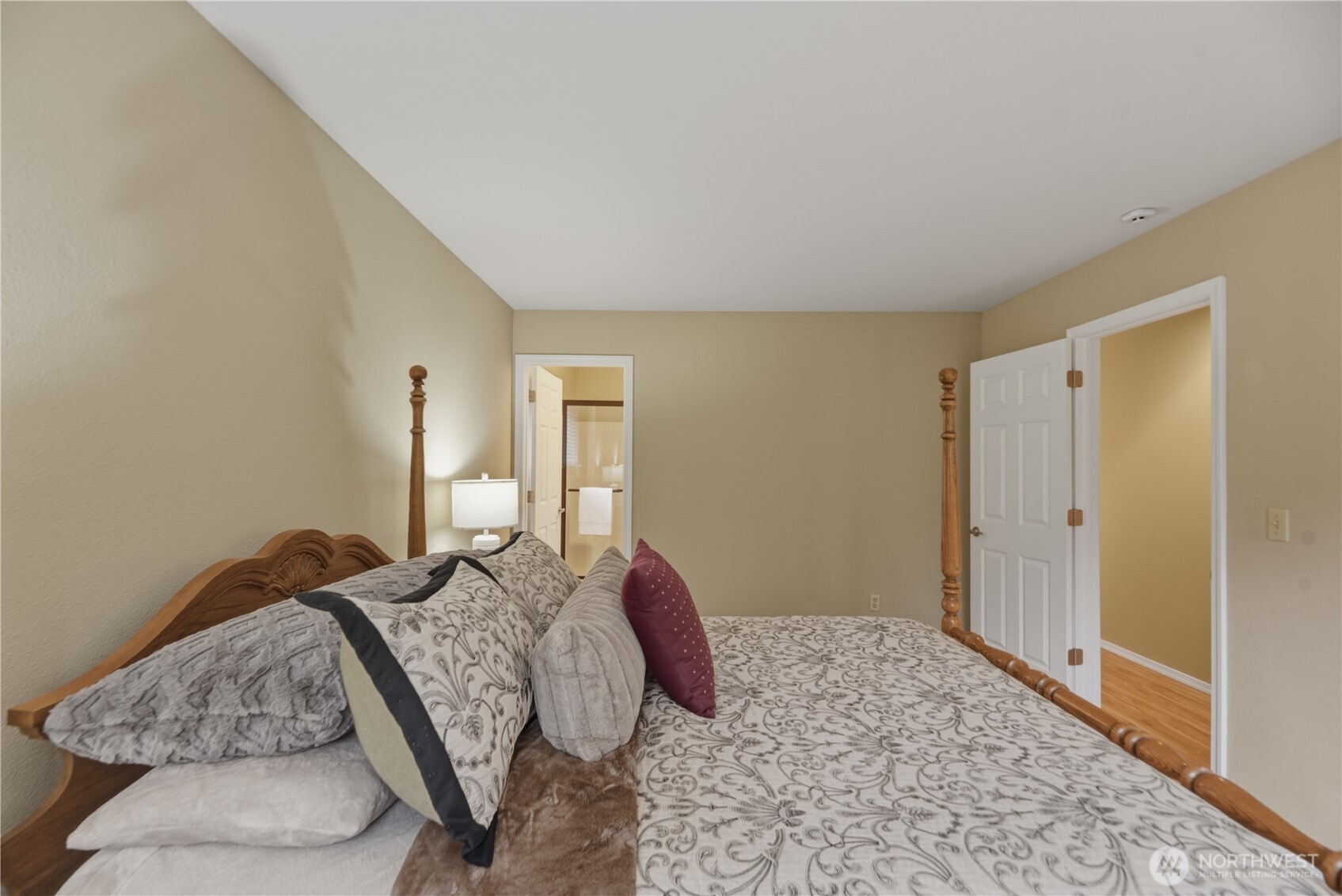 2415 Southeast 8th Place Renton, WA 98057 - Photo 15 of 39 a bedroom with a bed and wooden floor