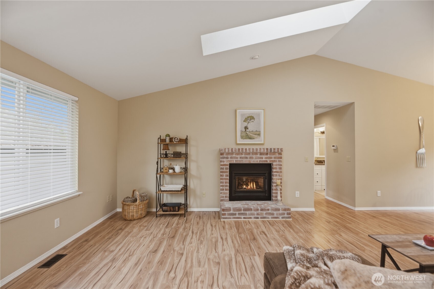 2415 Southeast 8th Place Renton, WA 98057 - Photo 3 of 39 a view of empty room with wooden floor and fireplace