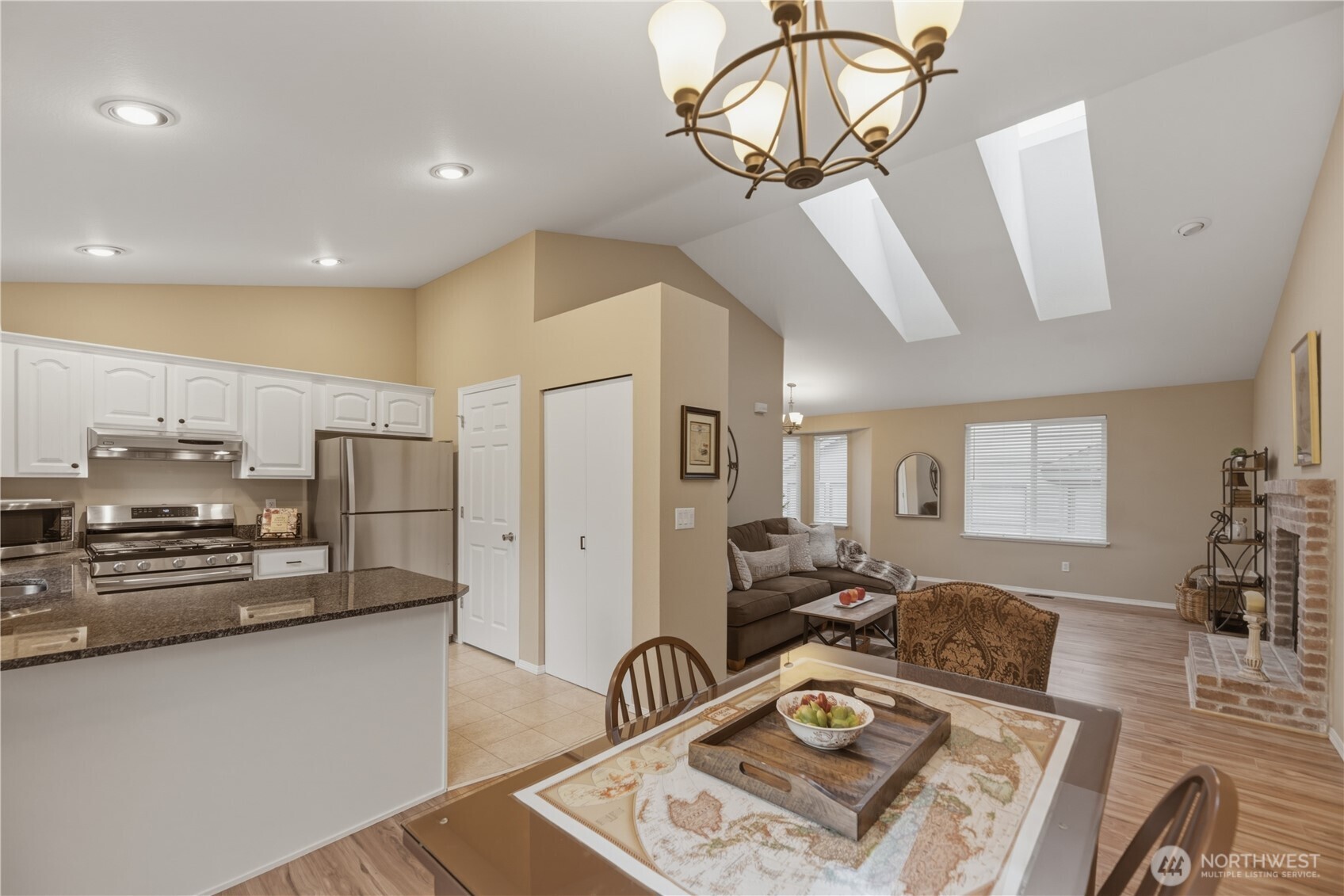 2415 Southeast 8th Place Renton, WA 98057 - Photo 8 of 39 a living room with furniture a couch and wooden floor