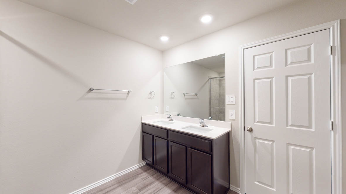 509 Hector Loop Georgetown, TX 78626 - Photo 19 of 31 Double vanity offers ample space, illuminated by recessed lighting.