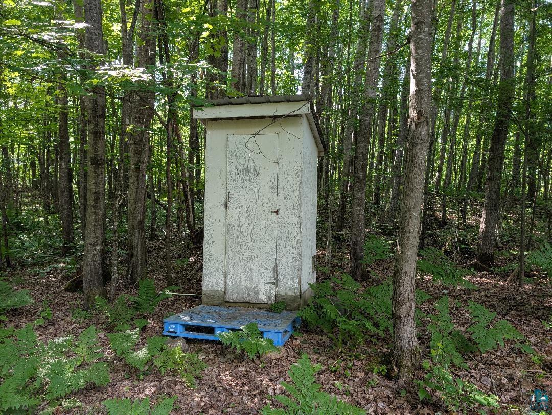 0 Randysek Road Cable, WI 54821 - Photo 2 of 26 View of shed featuring a wooded view