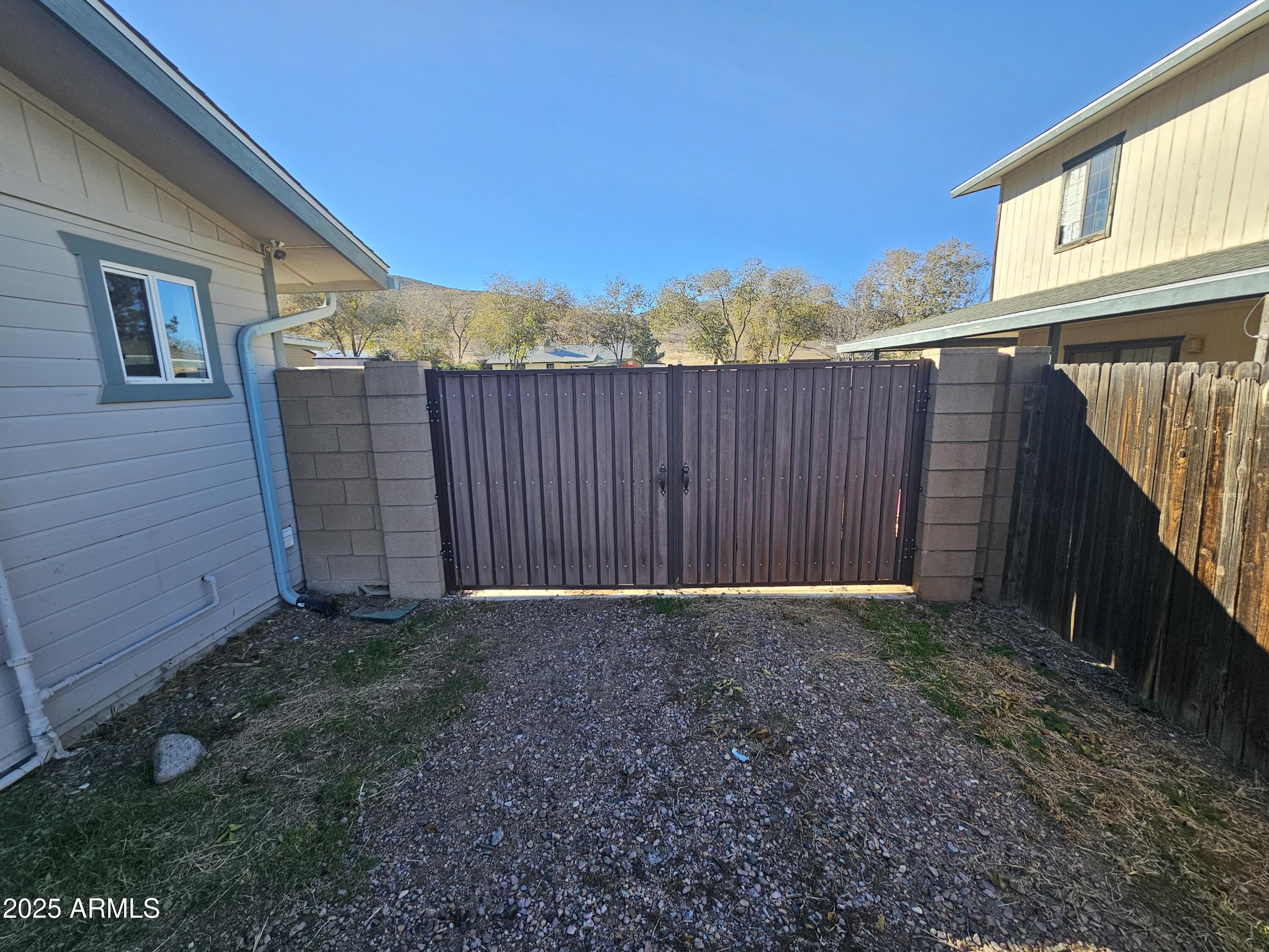 3500 North Tower Road Prescott Valley, AZ 86314 - Photo 12 of 14 a view of backyard with wooden fence and large trees