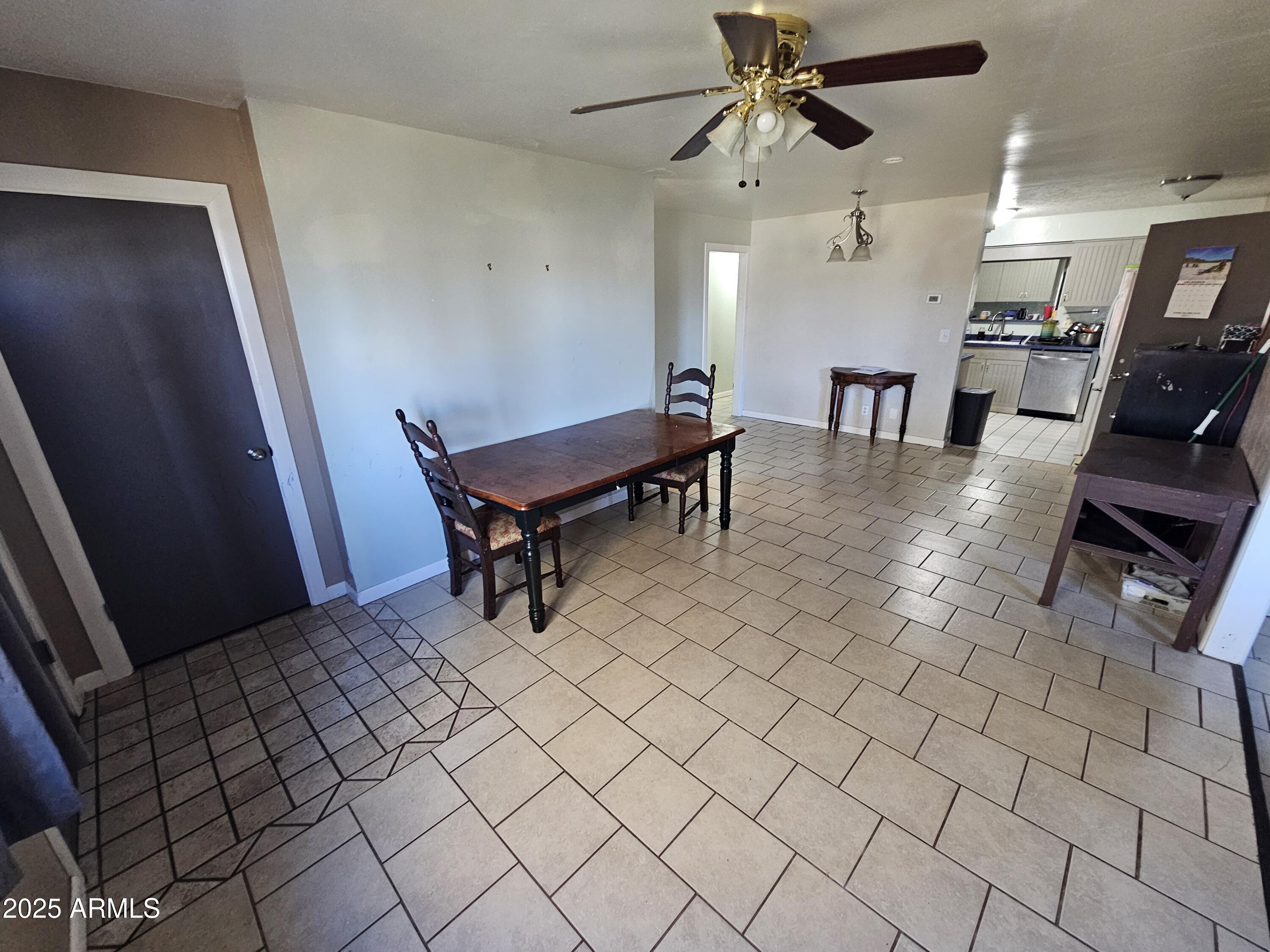 3500 North Tower Road Prescott Valley, AZ 86314 - Photo 2 of 14 a view of a livingroom with furniture and a ceiling fan