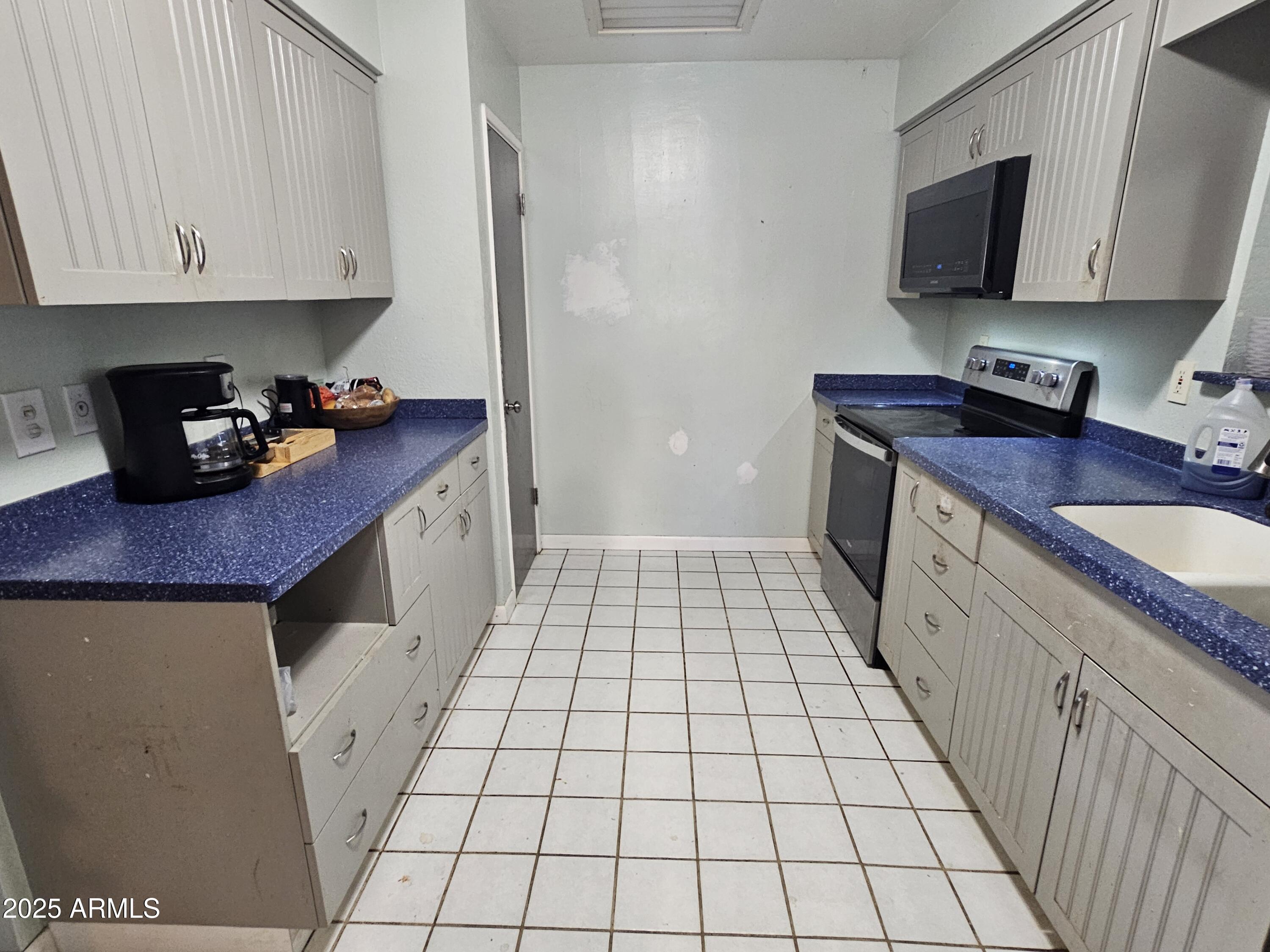 3500 North Tower Road Prescott Valley, AZ 86314 - Photo 4 of 14 a kitchen with a sink and a stove top oven