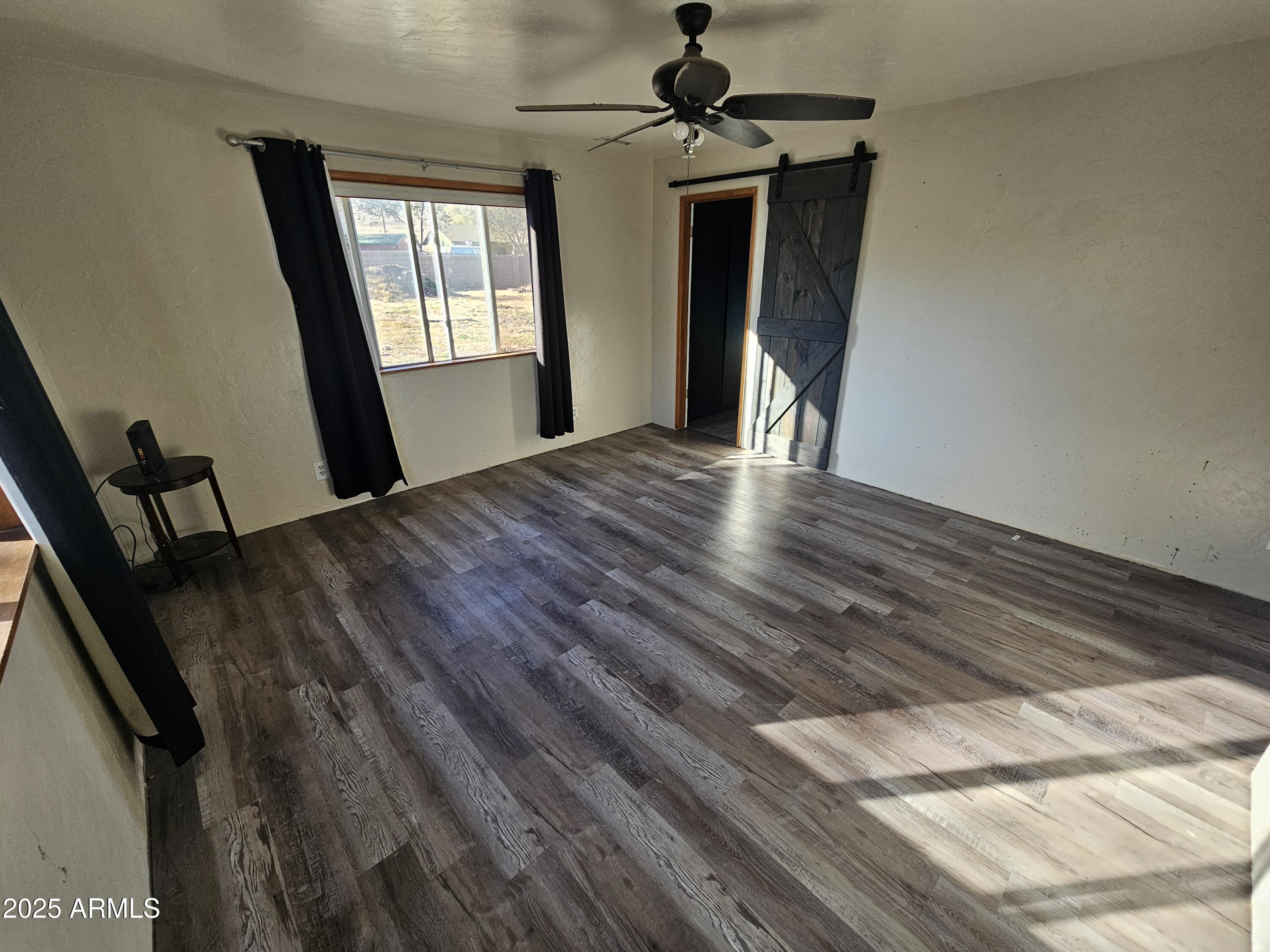 3500 North Tower Road Prescott Valley, AZ 86314 - Photo 6 of 14 a view of a hallway with a chandelier
