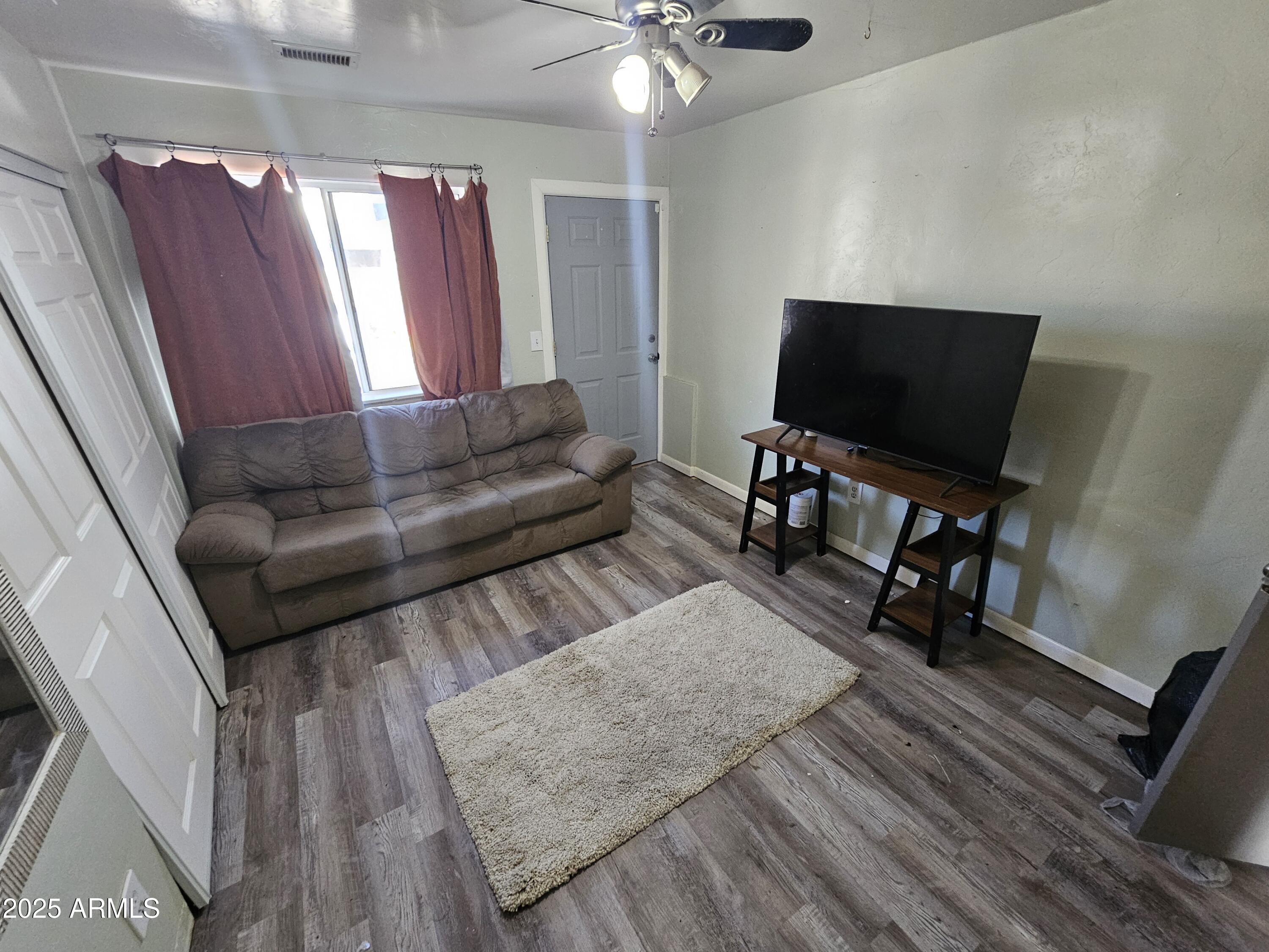 3500 North Tower Road Prescott Valley, AZ 86314 - Photo 8 of 14 a living room with furniture and a flat screen tv