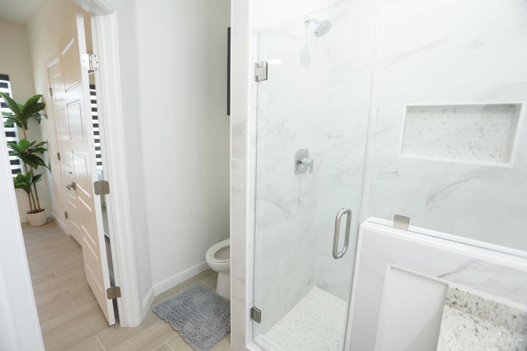 901 East Yuma Avenue, Unit 1806 McAllen, TX 78503 - Photo 12 of 12 a bathroom with a shower and toilet