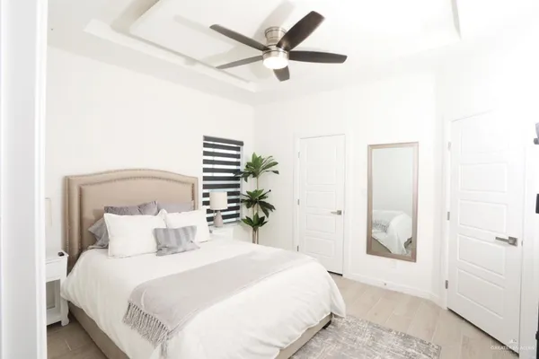 a bedroom with a bed and a glass door