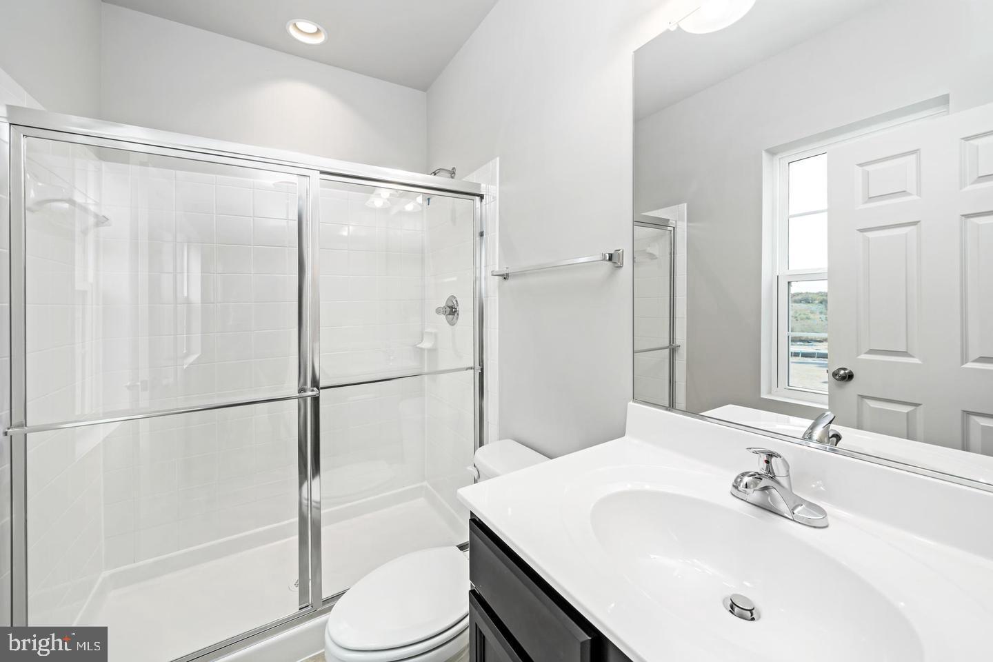204 Parkland Drive Stephenson, VA 22656 - Photo 4 of 6 a bathroom with a sink toilet and shower