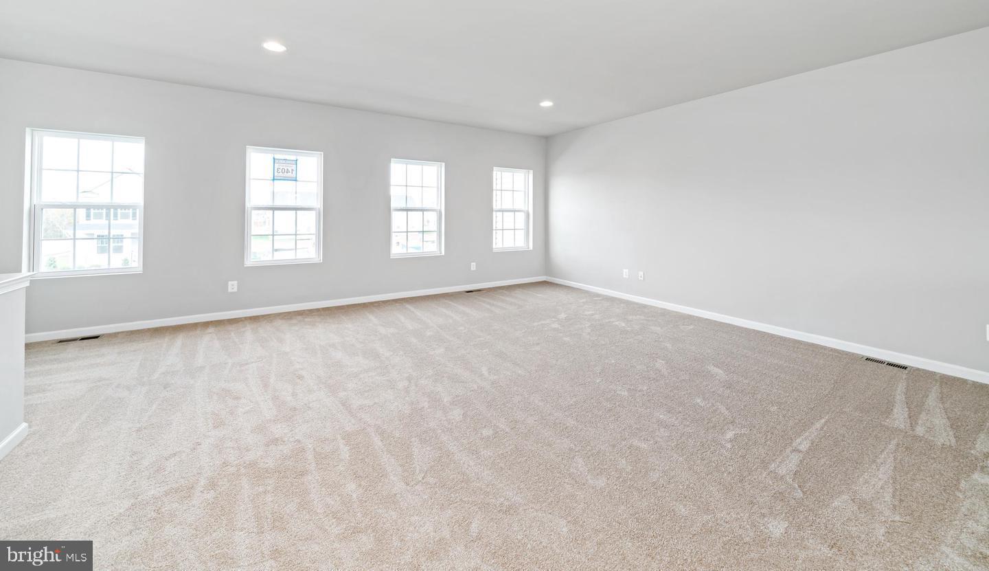204 Parkland Drive Stephenson, VA 22656 - Photo 6 of 6 an empty room with windows