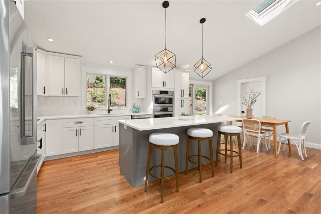 17 Saunders Road Lynnfield, MA 01940 - Photo 17 of 42 a large kitchen with a table and chairs