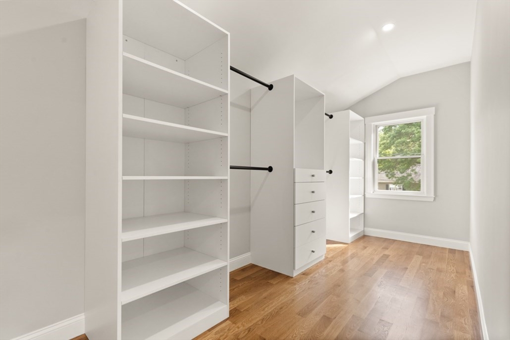 17 Saunders Road Lynnfield, MA 01940 - Photo 25 of 42 a view of an empty room with a window and wooden floor