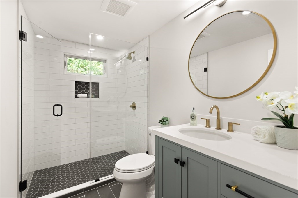 17 Saunders Road Lynnfield, MA 01940 - Photo 27 of 42 a bathroom with a sink and a mirror