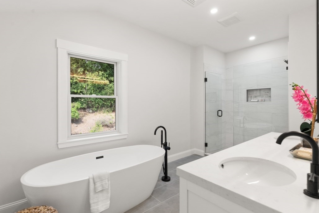 17 Saunders Road Lynnfield, MA 01940 - Photo 29 of 42 a bathroom with a sink and a bathtub