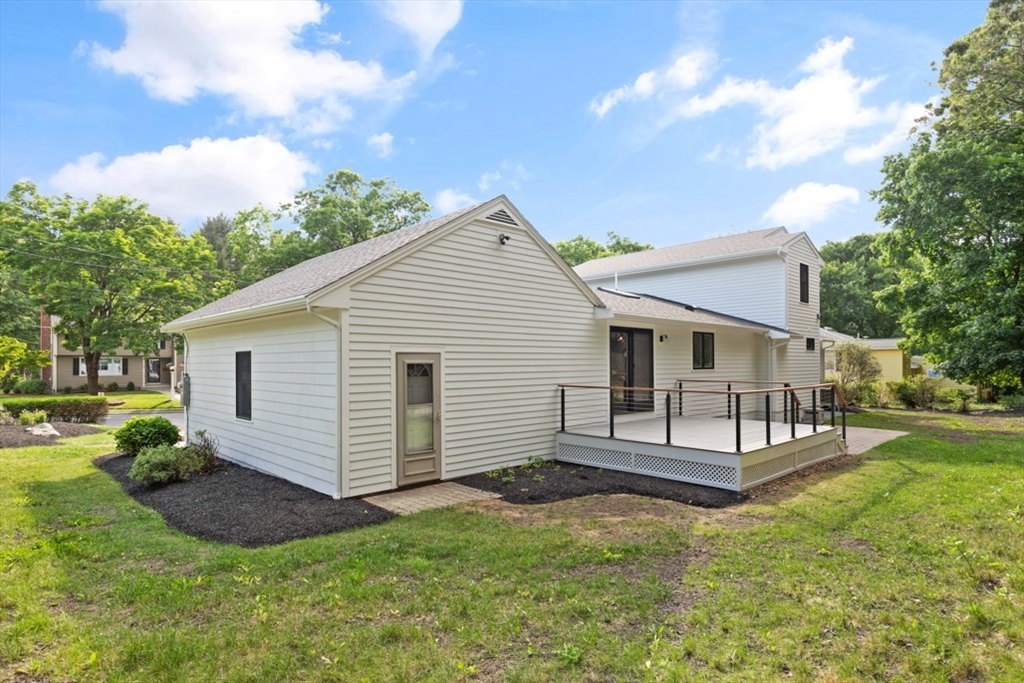 17 Saunders Road Lynnfield, MA 01940 - Photo 35 of 42 a view of a house with a yard and a garden