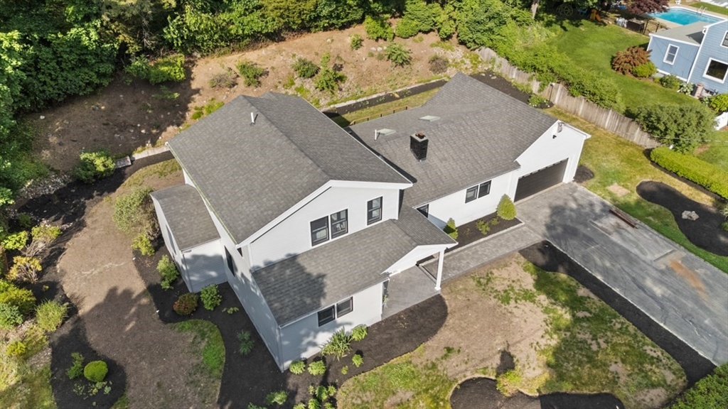 17 Saunders Road Lynnfield, MA 01940 - Photo 39 of 42 an aerial view of a house with a yard