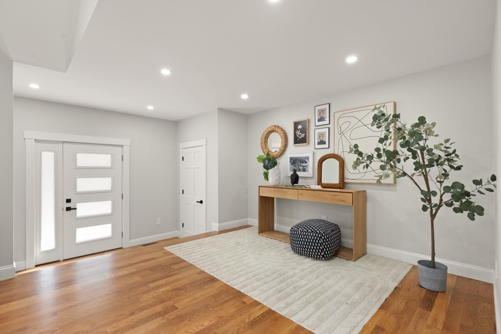 17 Saunders Road Lynnfield, MA 01940 - Photo 6 of 42 a living room with furniture and a potted plant