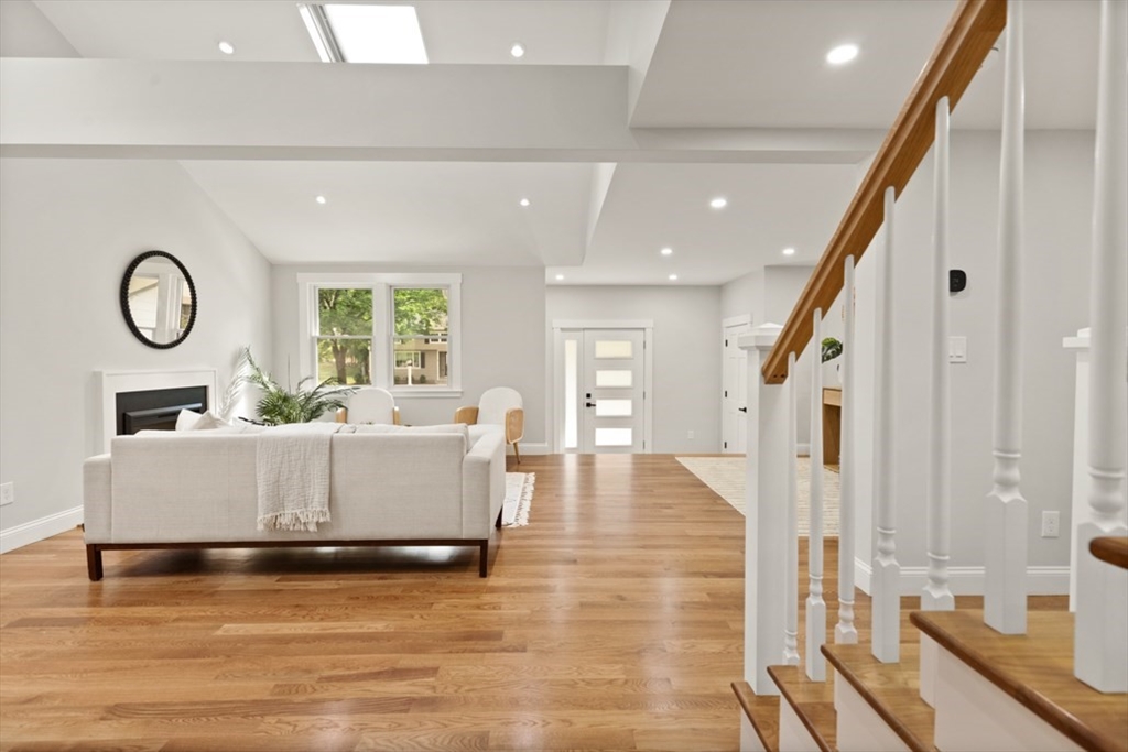17 Saunders Road Lynnfield, MA 01940 - Photo 7 of 42 a living room with fireplace furniture and a large window