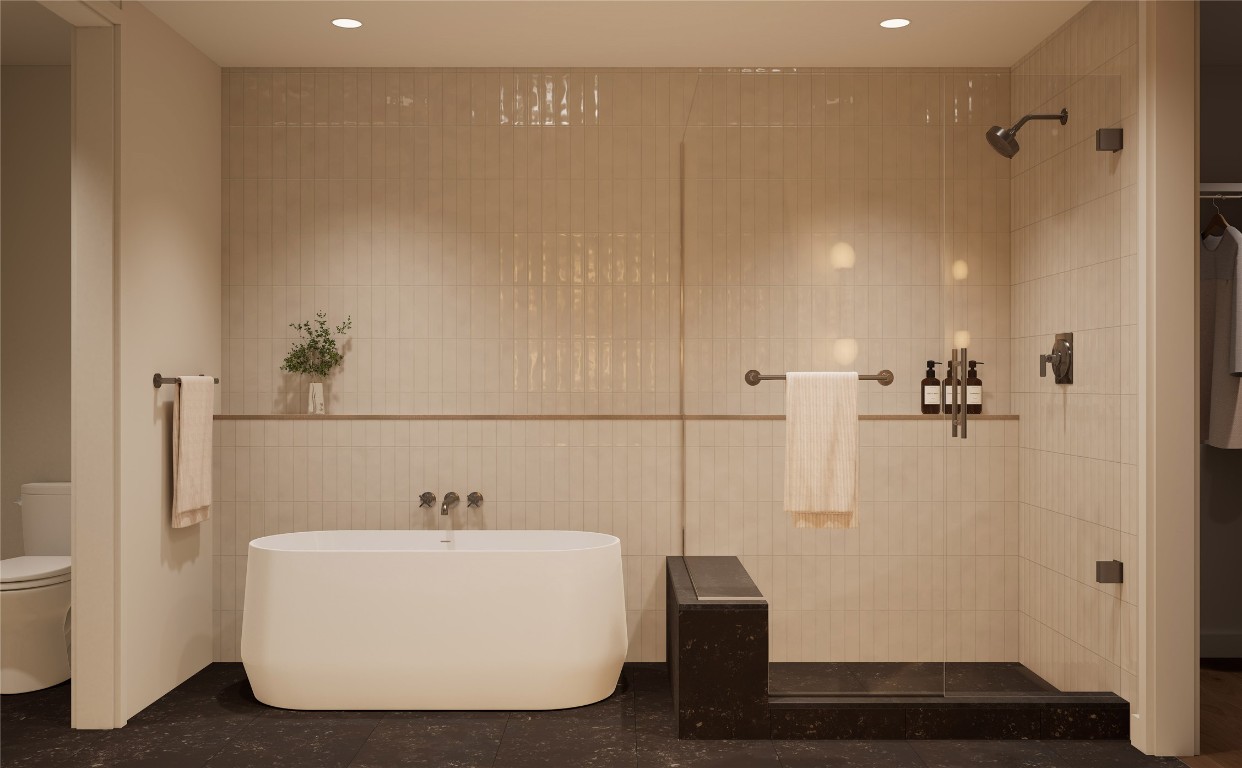 300 Pressler Street, Unit 216 Austin, TX 78703 - Photo 12 of 18
Primary bathroom in the Twilight palette, featuring a walk-in shower, freestanding tub, tiled walls, limestone flooring, and recessed lighting. A serene, spa-inspired retreat designed to promote relaxation and comfort.