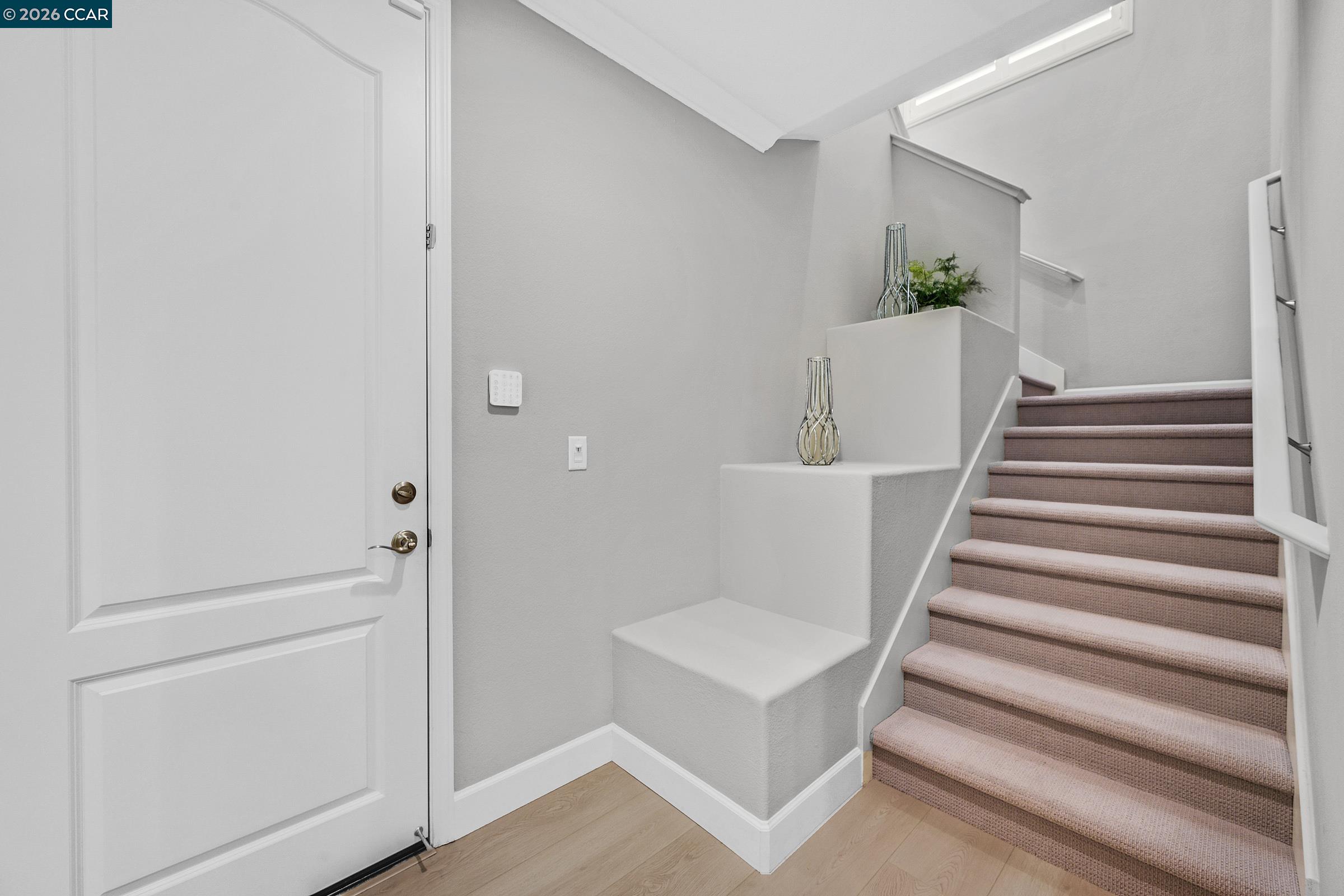111 Elworthy Ranch Drive Danville, CA 94526 - Photo 17 of 43 a view of a hallway with wooden floor and white walls