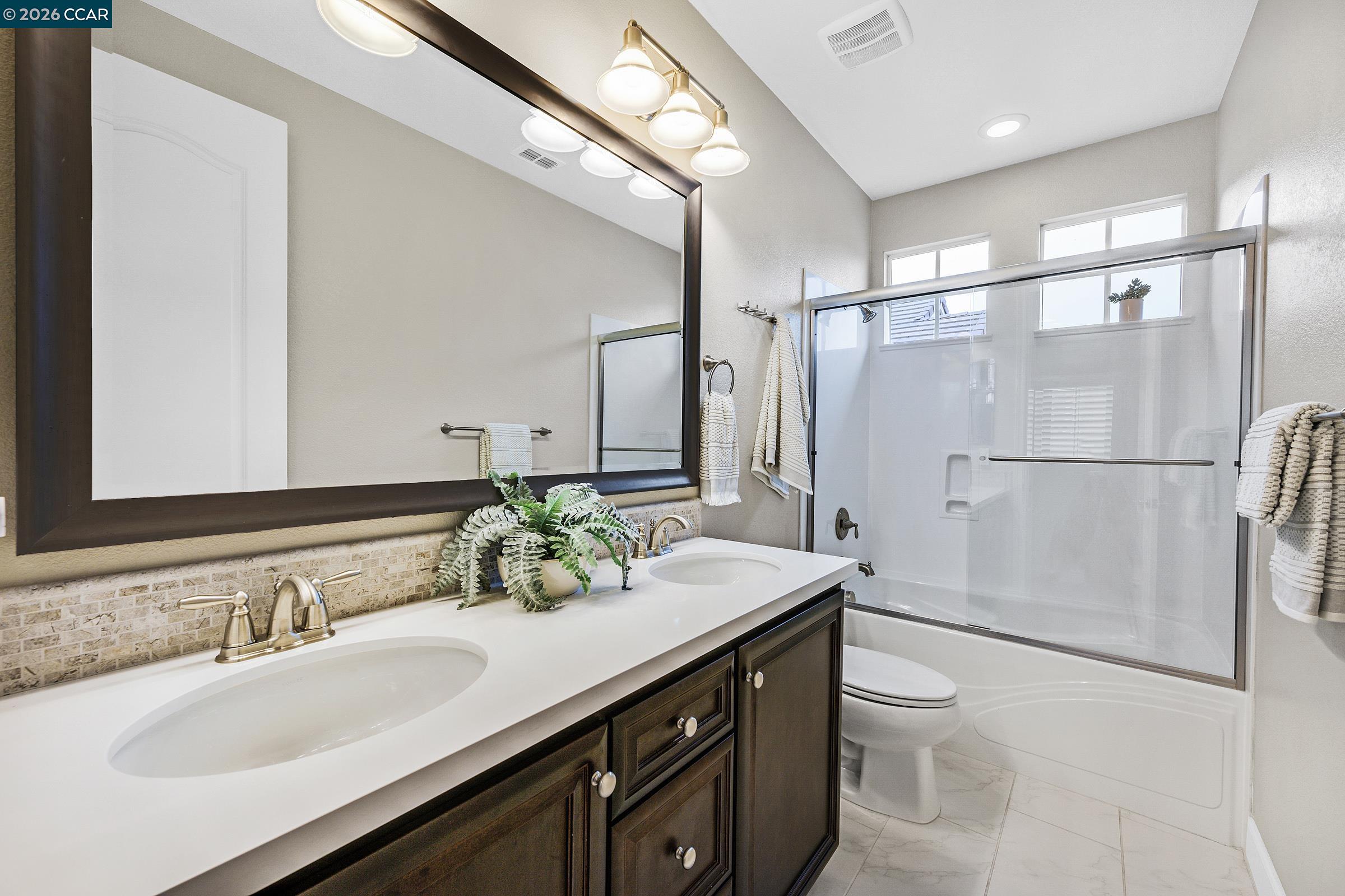111 Elworthy Ranch Drive Danville, CA 94526 - Photo 23 of 43 a bathroom with a granite countertop sink mirror and double