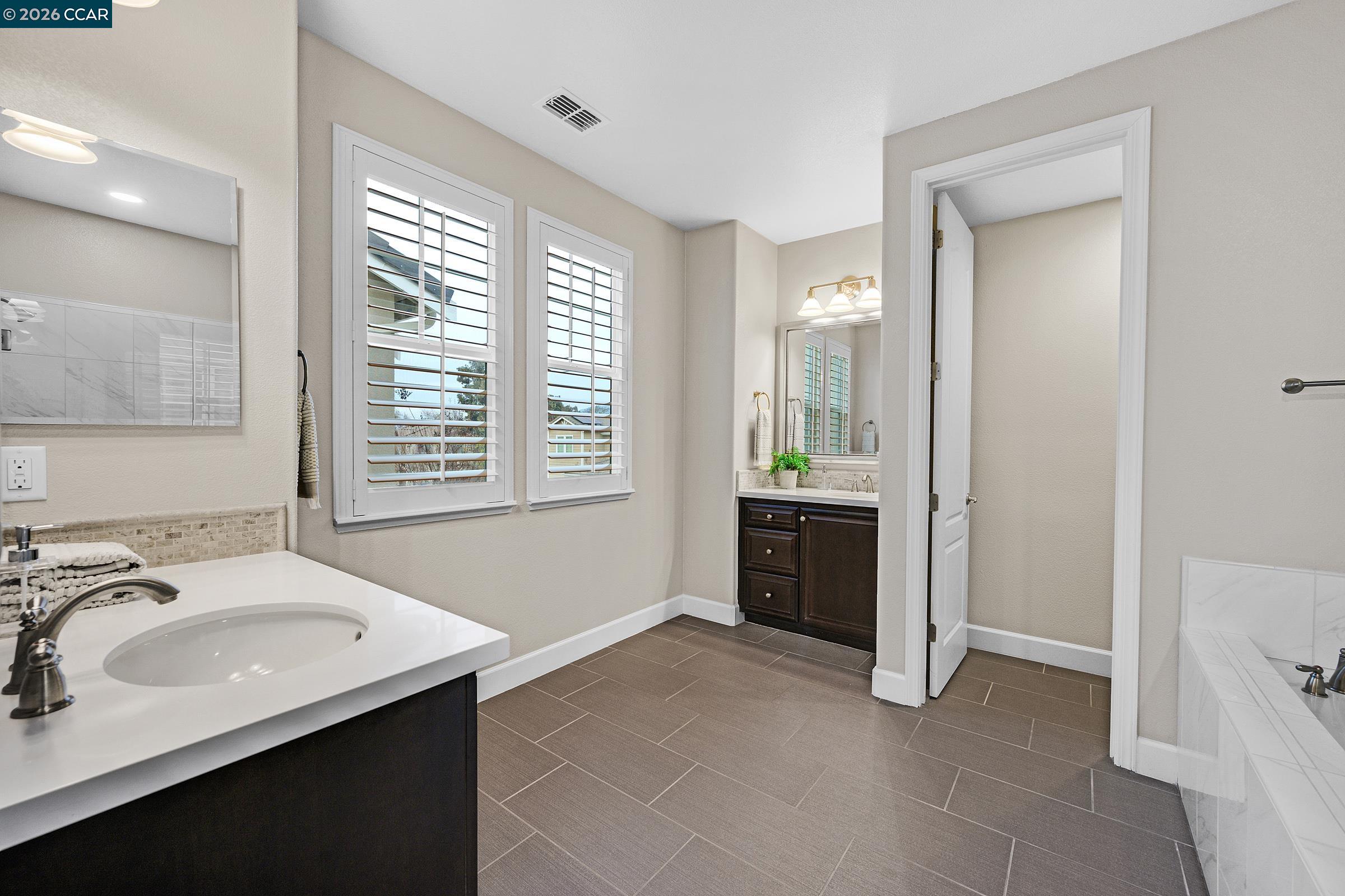 111 Elworthy Ranch Drive Danville, CA 94526 - Photo 29 of 43 a bathroom with a sink and a mirror