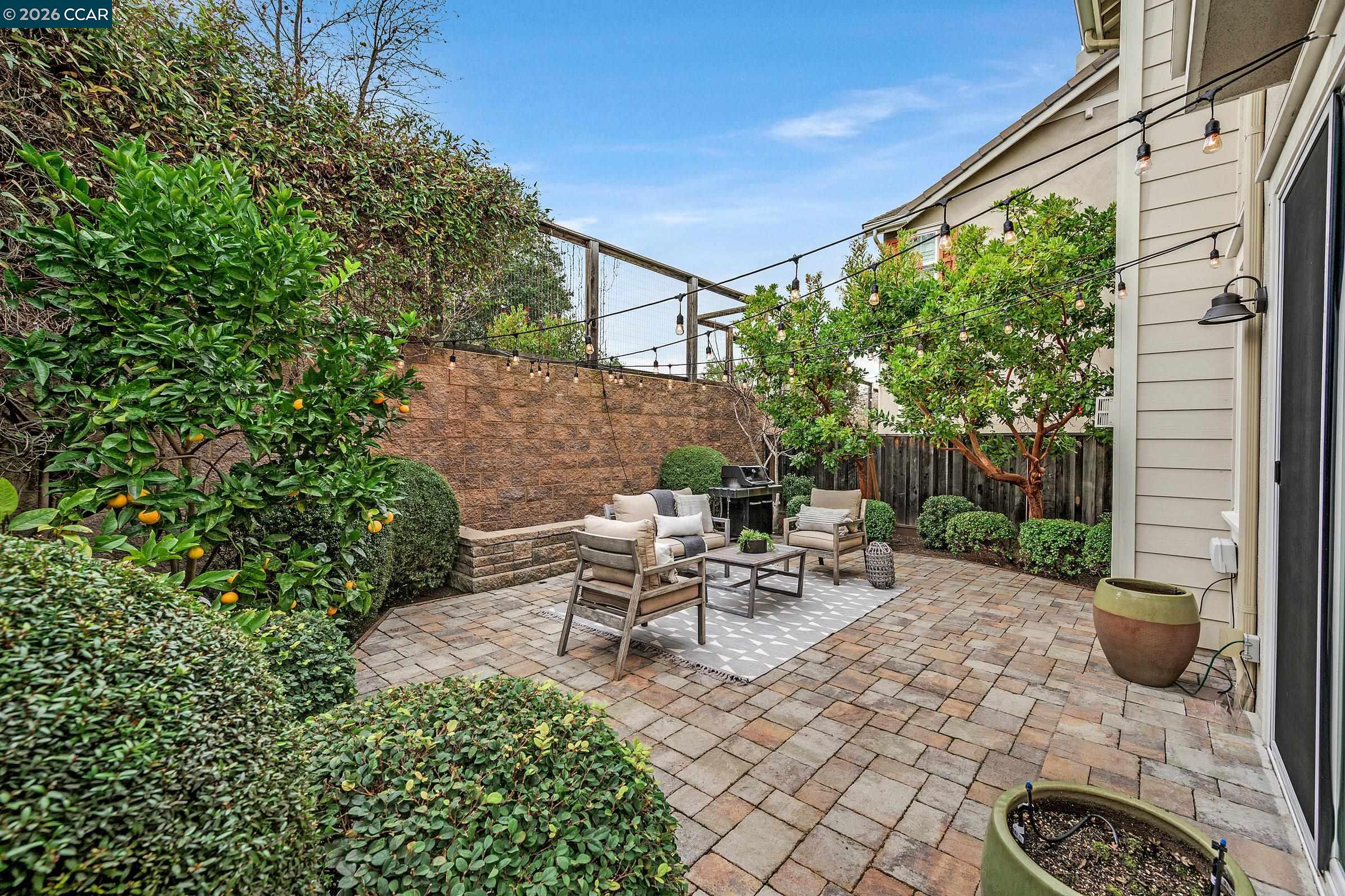111 Elworthy Ranch Drive Danville, CA 94526 - Photo 39 of 43 a view of a patio with table and chairs potted plants with wooden fence