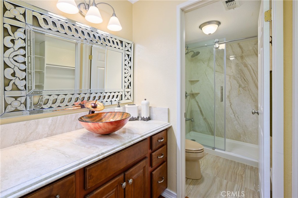 36 Corniche Drive, Unit B Dana Point, CA 92629 - Photo 19 of 37 Remodeled bathroom with Euro slider shower door