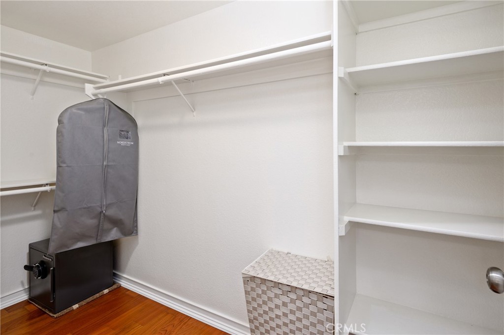 36 Corniche Drive, Unit B Dana Point, CA 92629 - Photo 21 of 37 Walk in closet with custom shelves and hanging bars