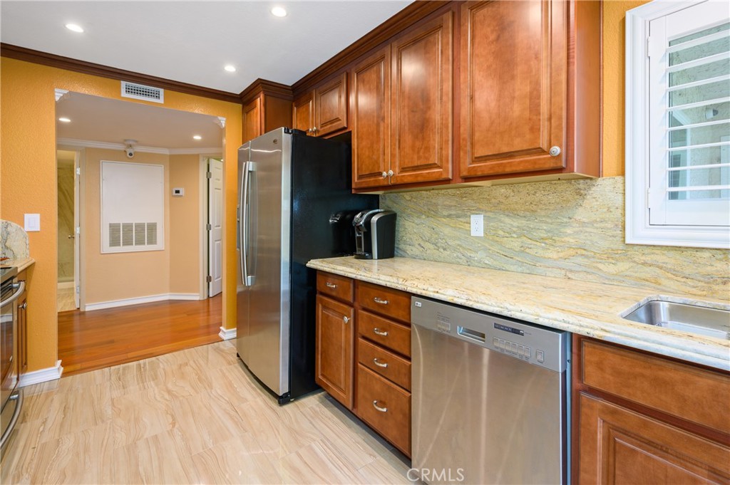 36 Corniche Drive, Unit B Dana Point, CA 92629 - Photo 10 of 37 Granite countertops and stainless steel appliances