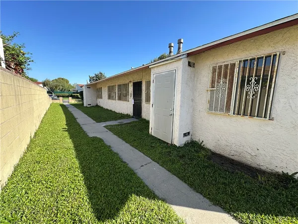 a front view of a house with yard