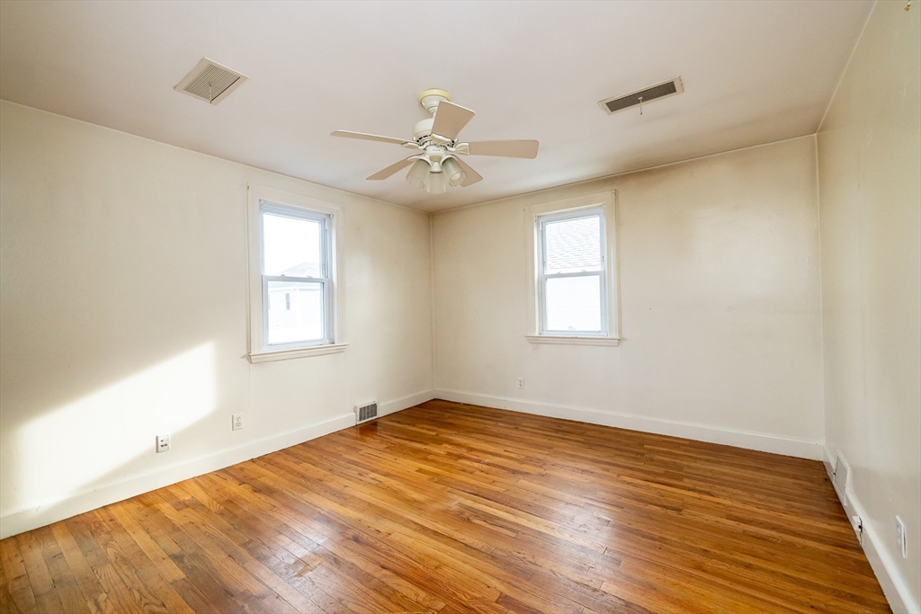 43 E Street Hull, MA 02045 - Photo 6 of 12 a view of empty room with wooden floor and fan