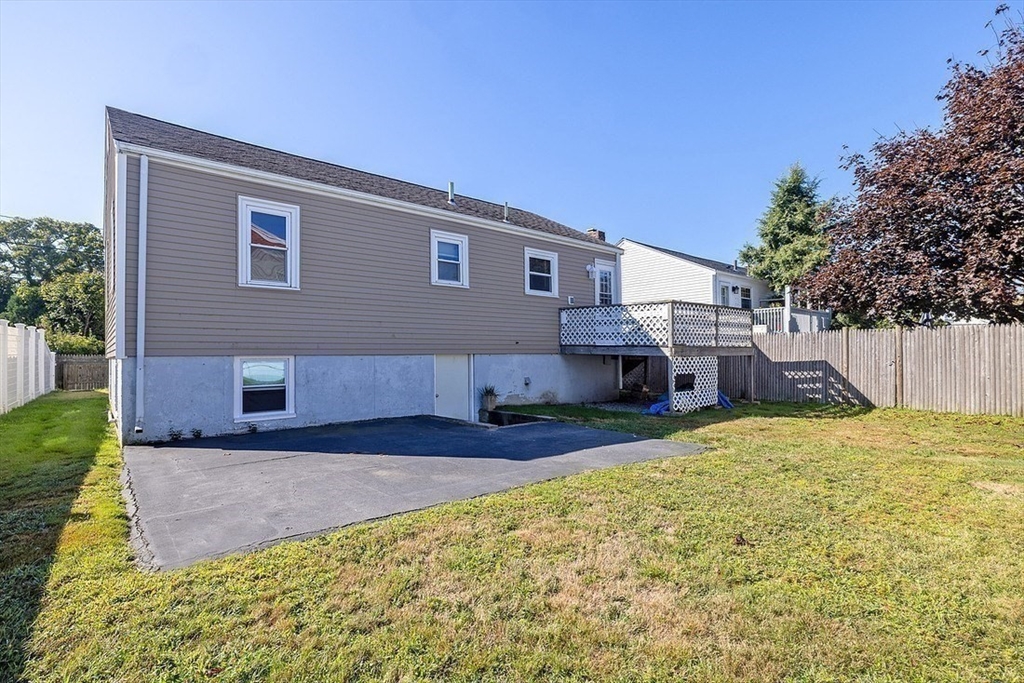 43 E Street Hull, MA 02045 - Photo 9 of 12 a backyard of a house with table and chairs