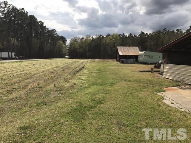 370 Randall Chapel Road Dunn, NC 28334 - Photo 7 of 10 a backyard of a house with table and chairs
