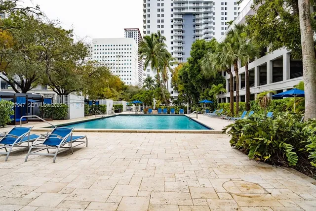 a view of a swimming pool with a lounge chairs