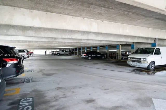 a view of parking with cars parked