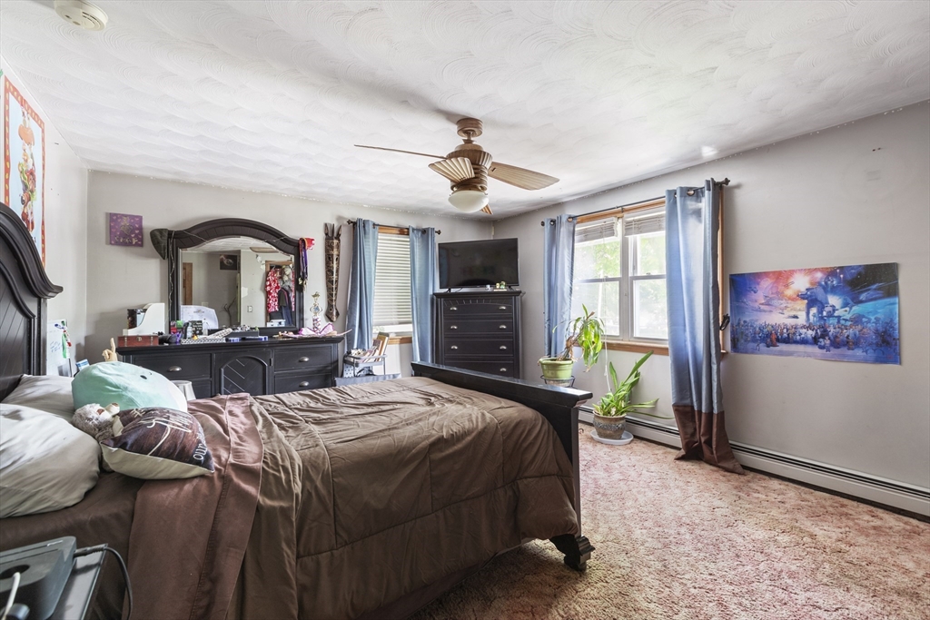 20 1/2 Bliss Street, Unit 2 Taunton, MA 02780 - Photo 12 of 18 a bed room with a bed and a television