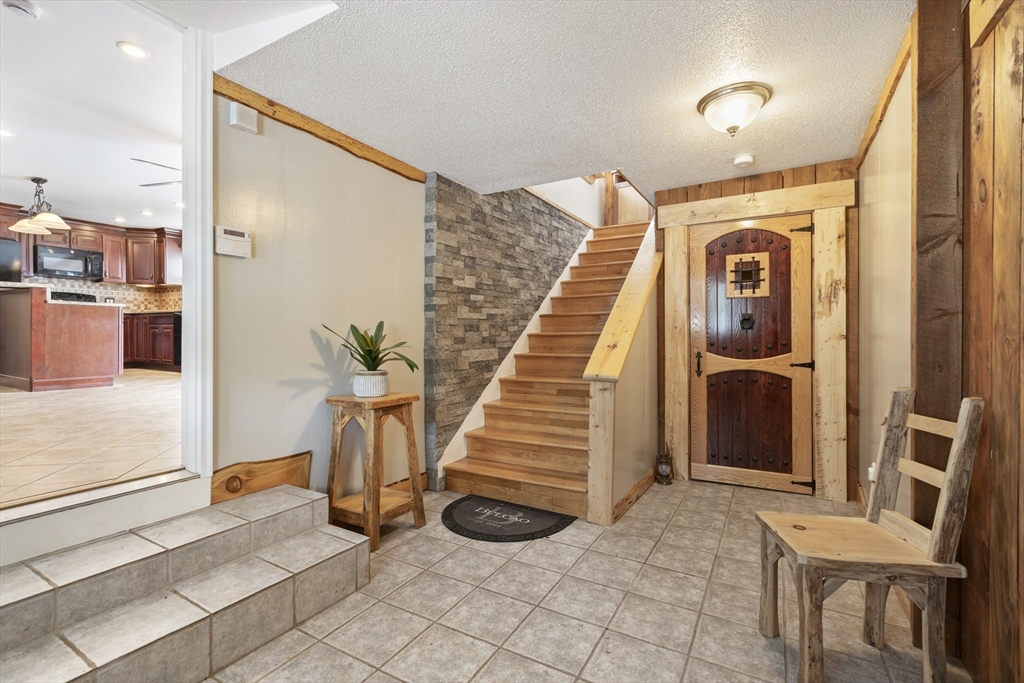20 1/2 Bliss Street, Unit 2 Taunton, MA 02780 - Photo 2 of 18 a view of a hallway with staircase