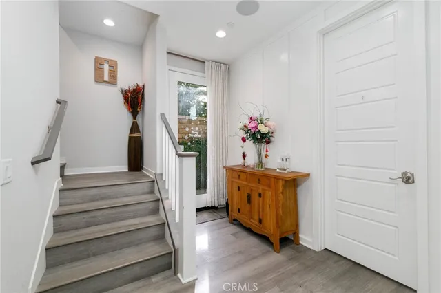 a room with stairs and wooden floor